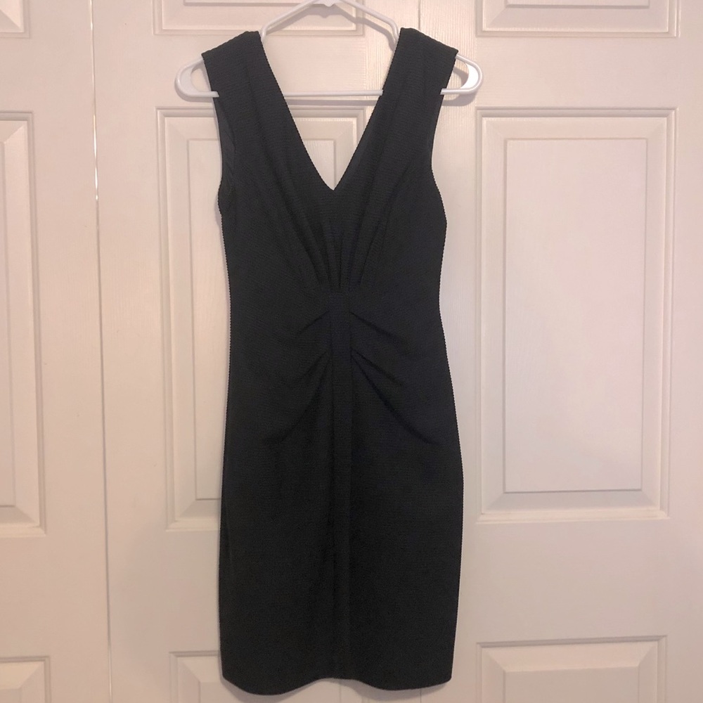 Black mini dress with exposed gold zipper